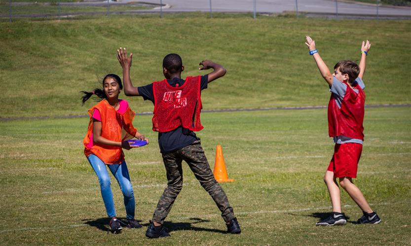 Students play ultimate frisbee